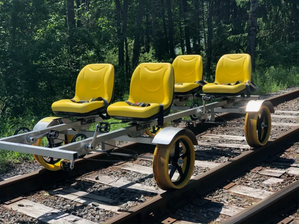 Image of yellow railbikes on a track